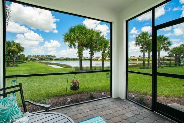 unfurnished sunroom with a water view