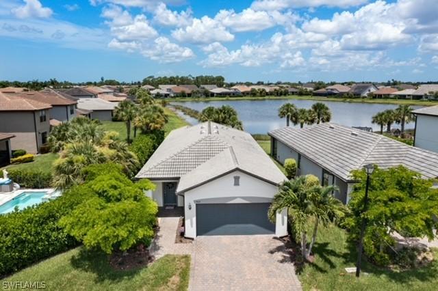 birds eye view of property with a residential view and a water view