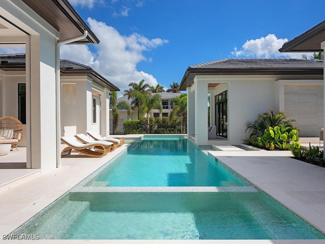 view of swimming pool featuring a patio