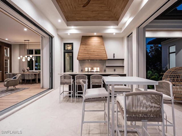 view of patio / terrace with exterior bar and an outdoor kitchen