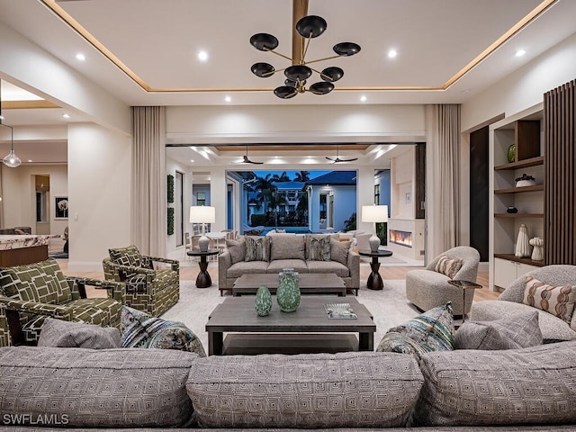 living room with a chandelier and carpet floors