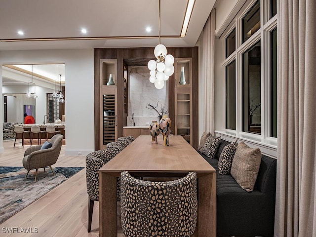 dining room featuring a chandelier and light wood-type flooring