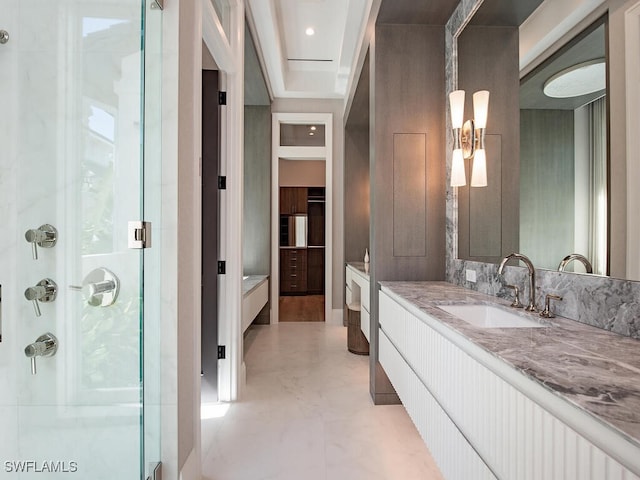 bathroom with vanity and a shower with door