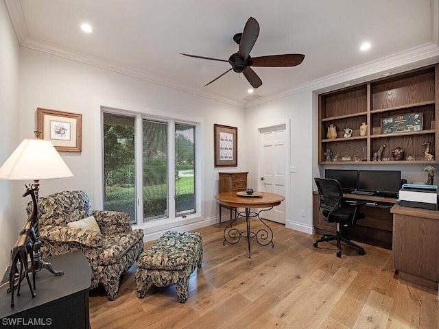 home office with ceiling fan, light wood-type flooring, and crown molding