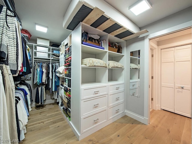 spacious closet with light wood-type flooring