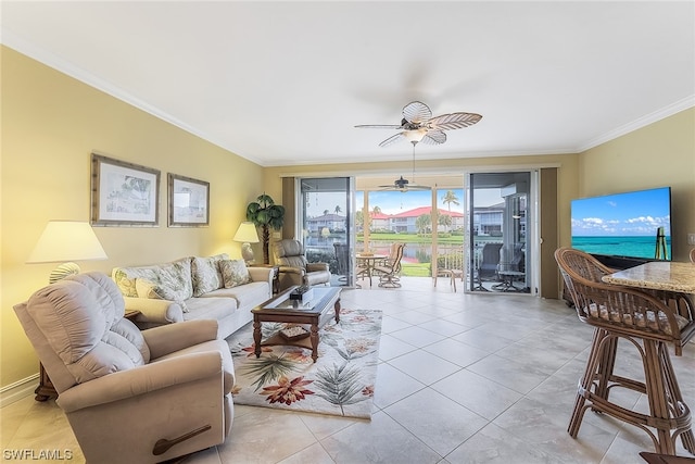 tiled living room featuring ceiling fan and ornamental molding