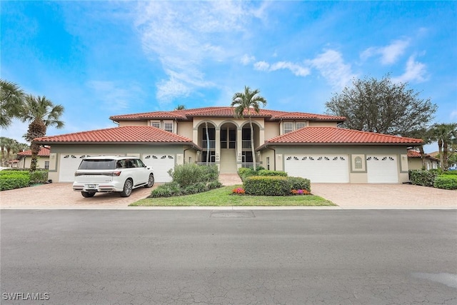 mediterranean / spanish-style home featuring a garage