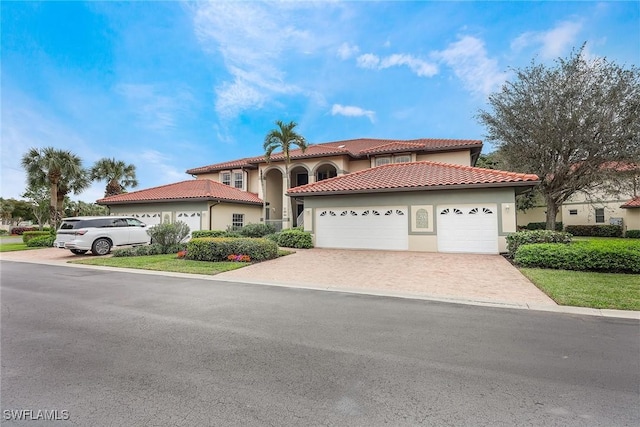 mediterranean / spanish-style house featuring a garage