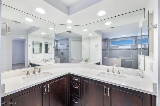 bathroom with vanity and an enclosed shower