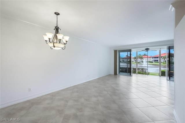 spare room with ceiling fan with notable chandelier, a wall of windows, and ornamental molding