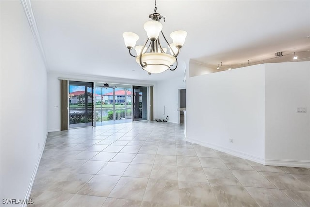 tiled empty room with expansive windows and a notable chandelier