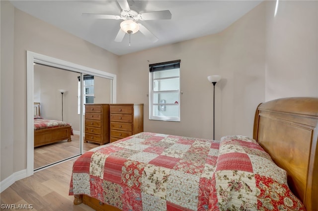 bedroom featuring light wood-type flooring, a closet, and ceiling fan