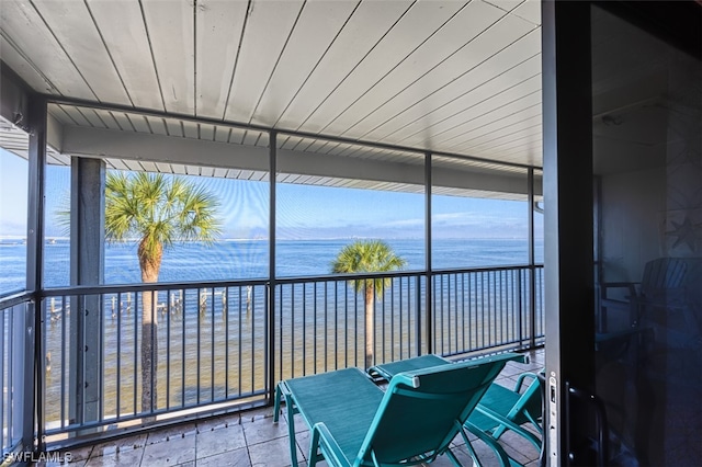 sunroom with a water view