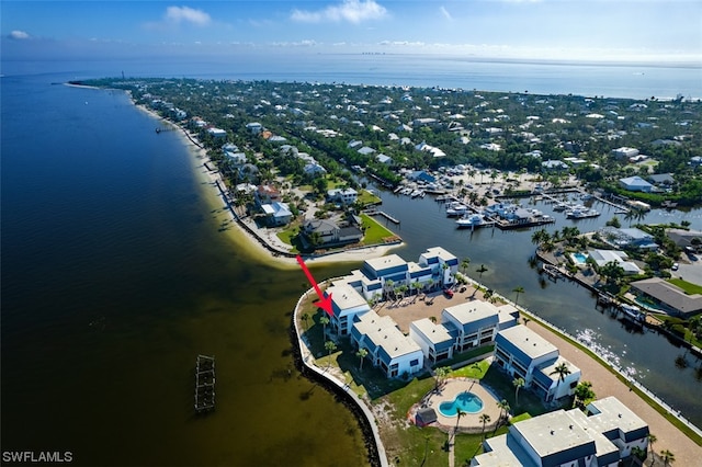 birds eye view of property featuring a water view