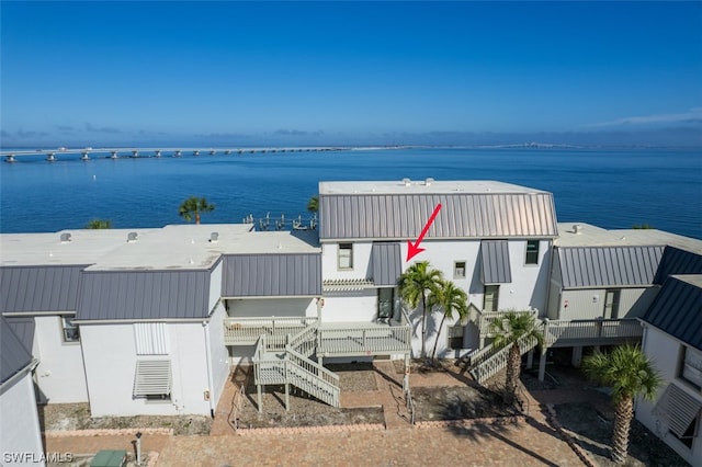 exterior space with a water view