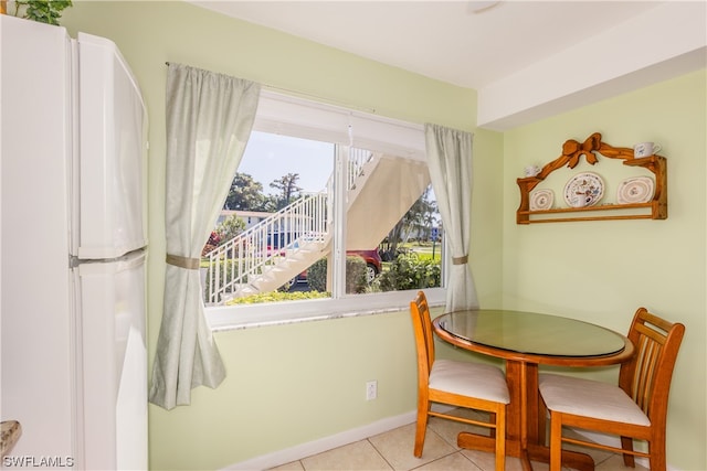 dining space with light tile patterned floors