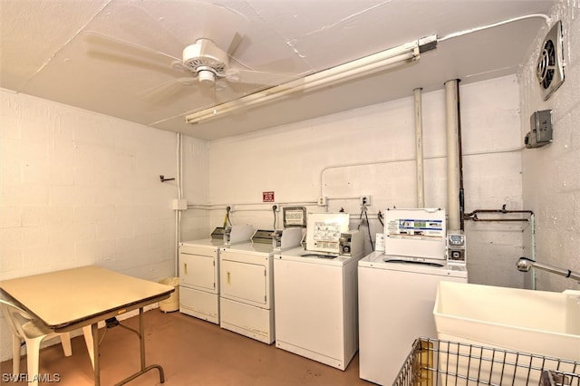 clothes washing area featuring washer and dryer, ceiling fan, and sink