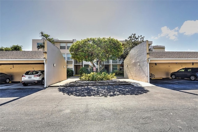 view of front of home with a carport