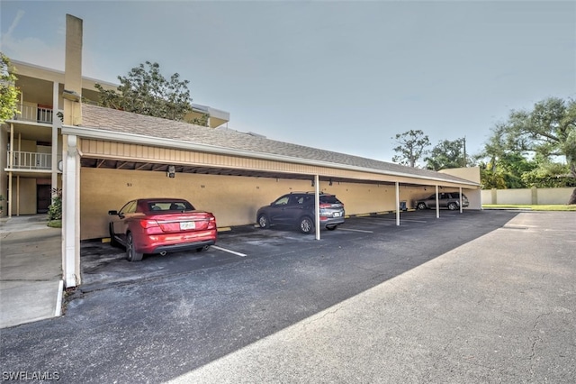 view of car parking featuring a carport