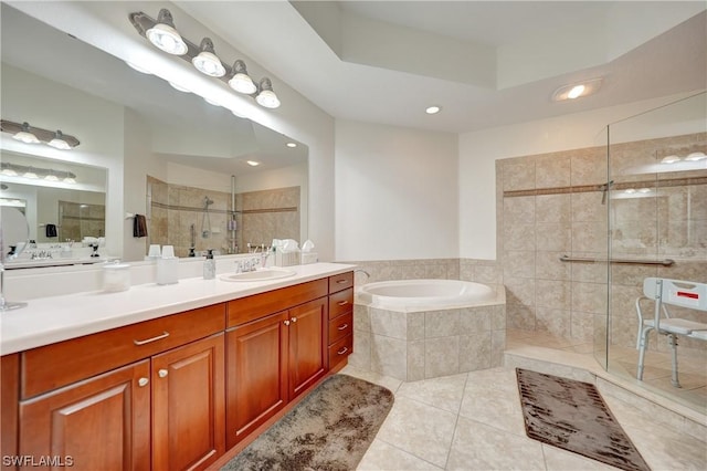 bathroom featuring tile patterned flooring, vanity, and independent shower and bath