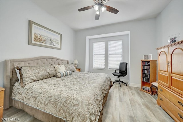 bedroom with ceiling fan and light hardwood / wood-style flooring