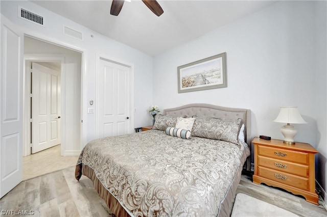 bedroom with ceiling fan and light wood-type flooring