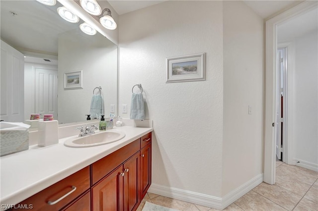 bathroom featuring tile patterned flooring and vanity