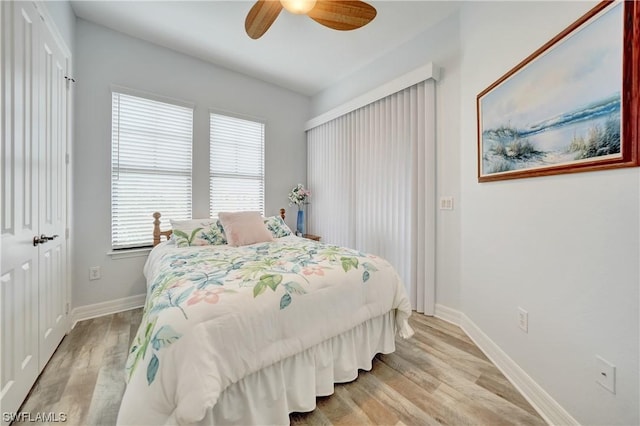 bedroom featuring light hardwood / wood-style floors and ceiling fan