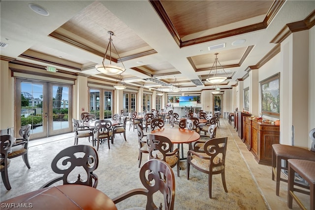 dining room featuring french doors, ornamental molding, and a tray ceiling