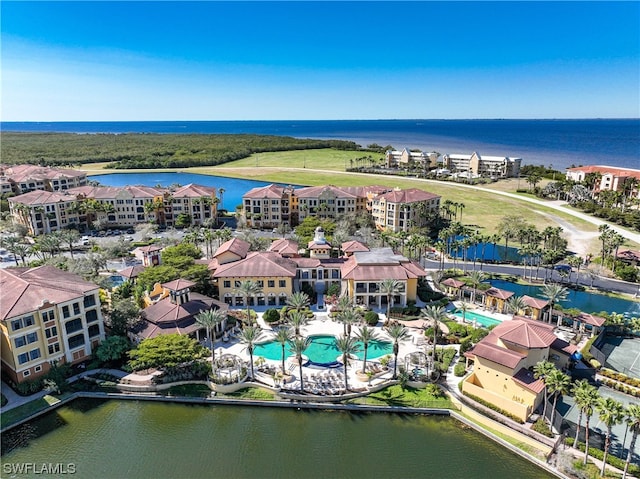 birds eye view of property with a water view