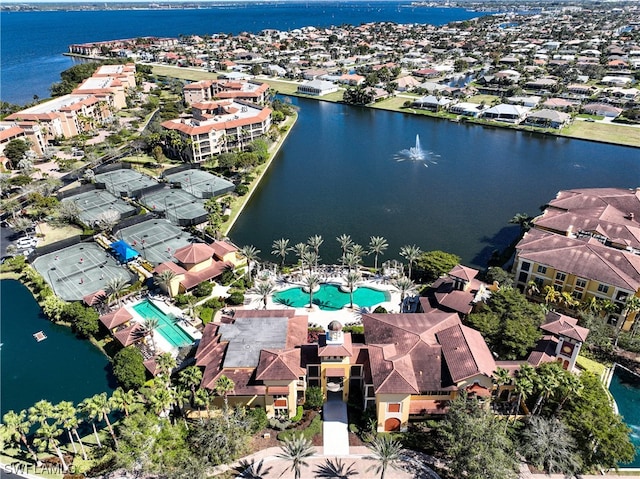 birds eye view of property with a water view