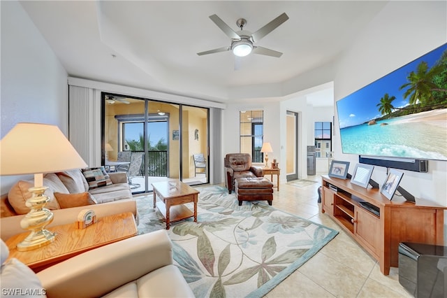 living room featuring ceiling fan and light tile patterned floors