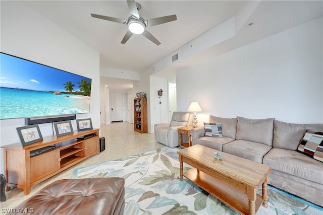 tiled living room with ceiling fan