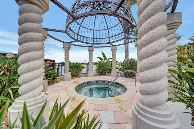 view of swimming pool with an in ground hot tub and a patio area