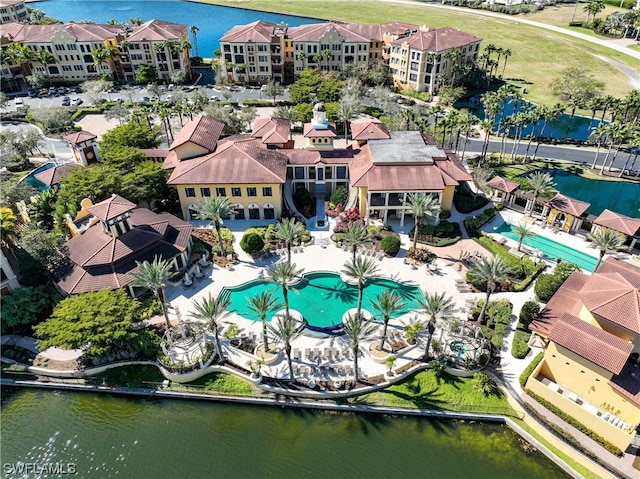 birds eye view of property featuring a water view