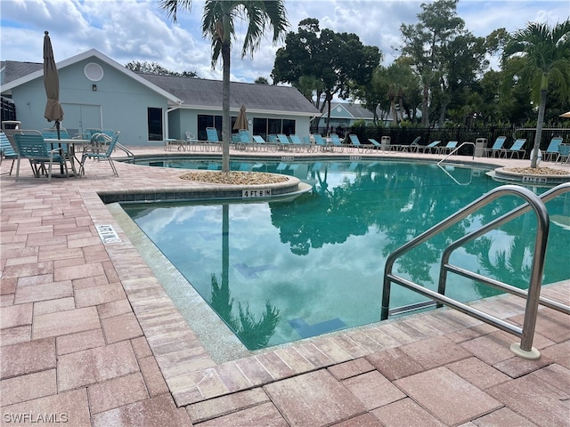 view of swimming pool featuring a patio