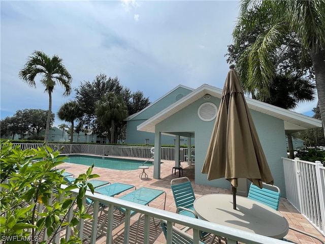 view of swimming pool featuring a patio area