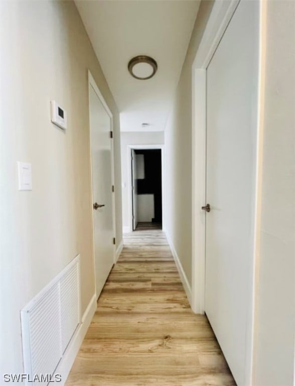 corridor featuring light wood-type flooring