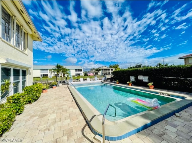 view of pool featuring a patio