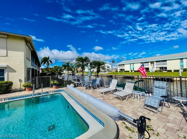 view of swimming pool featuring a patio area