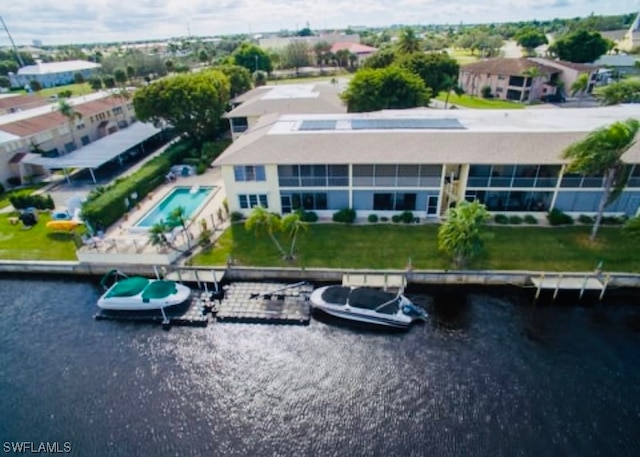 birds eye view of property with a water view