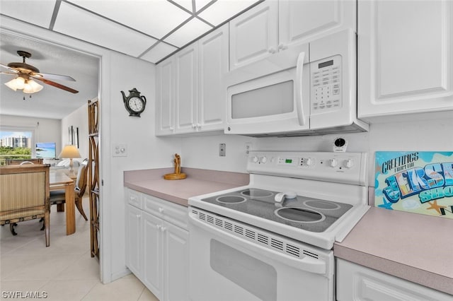 kitchen featuring white cabinetry, white appliances, light tile flooring, and ceiling fan