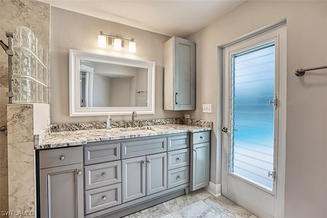 bathroom with vanity and tile flooring