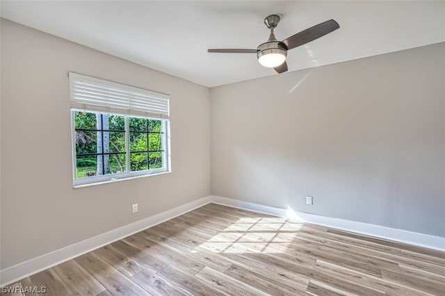 empty room with light hardwood / wood-style floors and ceiling fan