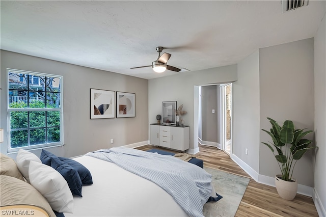 bedroom featuring ceiling fan and light hardwood / wood-style flooring