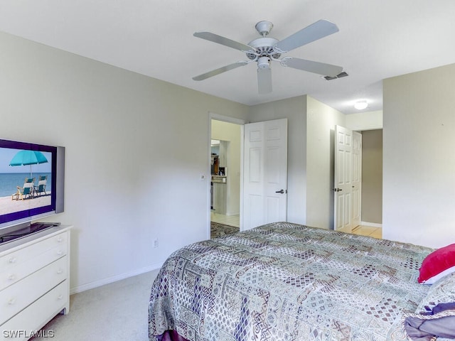 bedroom featuring a ceiling fan, visible vents, light colored carpet, and baseboards