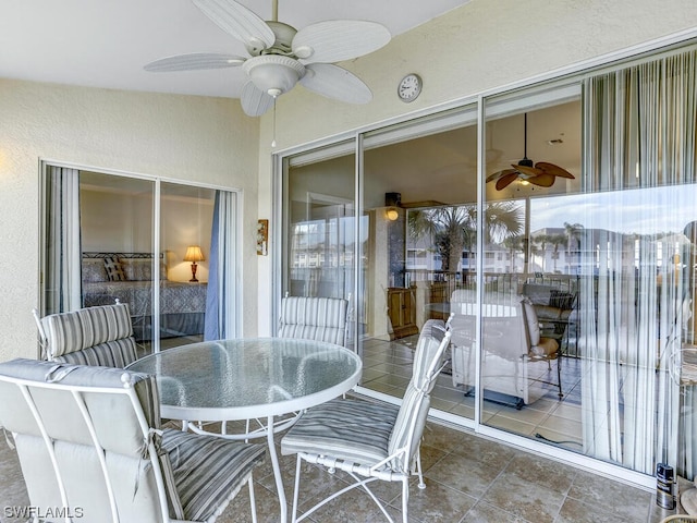 sunroom with a ceiling fan