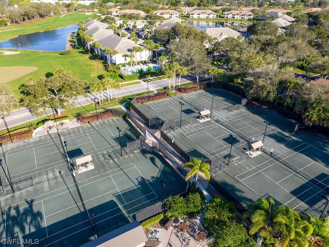 birds eye view of property featuring a residential view, a water view, and view of golf course