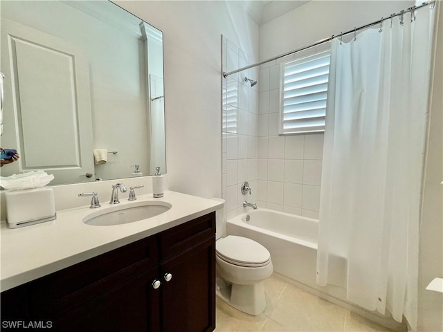 full bathroom with tile patterned floors, vanity, toilet, and shower / bath combo with shower curtain