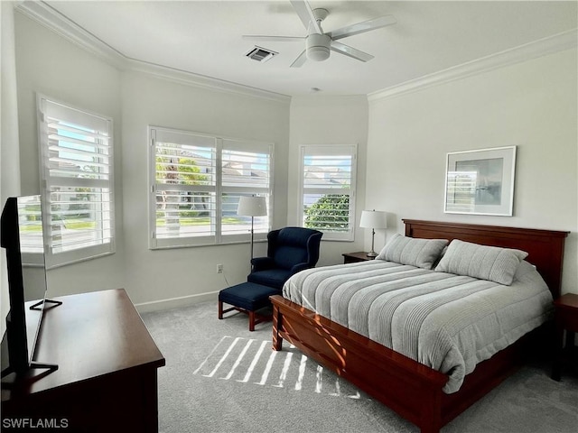 bedroom featuring ceiling fan, light colored carpet, crown molding, and multiple windows